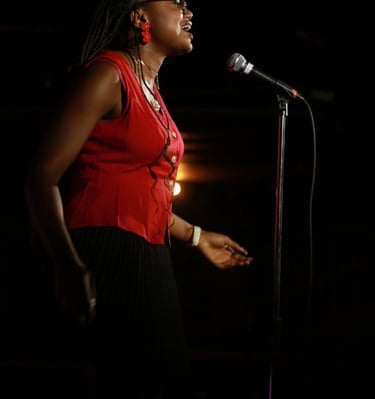 Iheoma Uzomba Oma is Loud performs poetry at the Calgary Poetry Slam