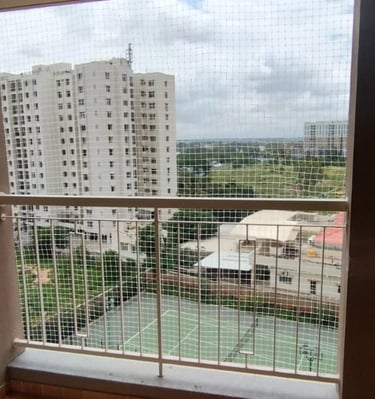 A balcony safety net blending seamlessly with the building’s exterior in Ambattur.