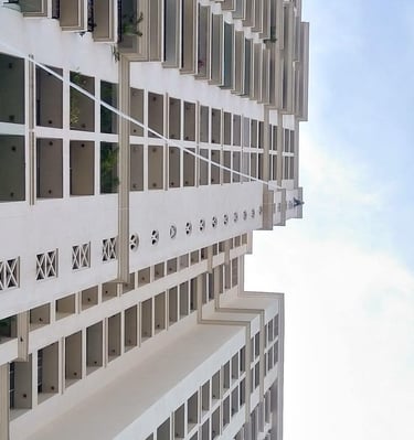Installation team fitting a safety net on an apartment exterior in Pune.