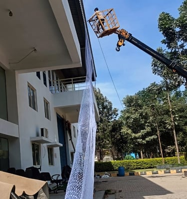 perspective of multiple warehouses in Bangalore fitted with protective pigeon nets.