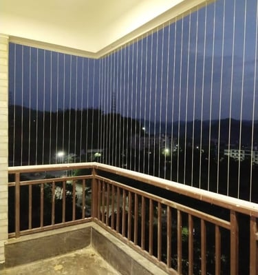 Evening shot of a home in Anna Nagar with invisible grills softly illuminated by ambient light.