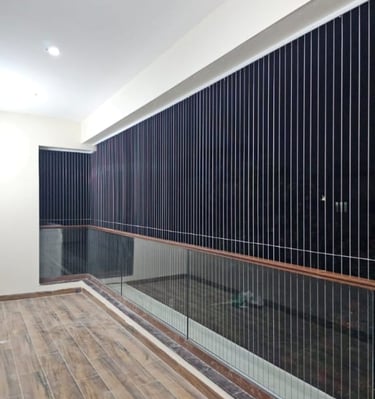 Close-up of sleek invisible grill installed on a window in Anna Nagar.