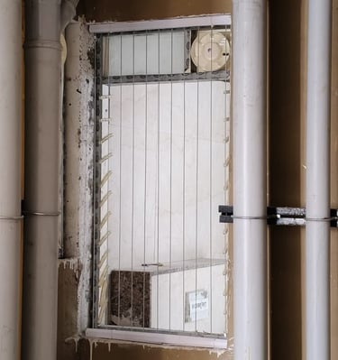 Evening scene of a balcony with invisible grills softly lit by ambient lighting