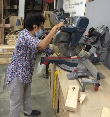 Lady managing a mitre saw