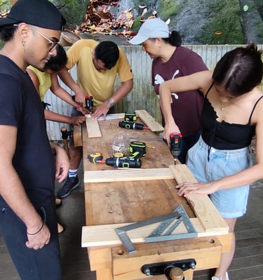 Group wood workshop making classroom furniture