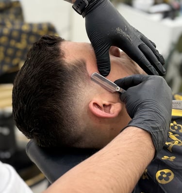Traditional straight razor shave with hot towel service at Unlimited Barbershop Etobicoke.