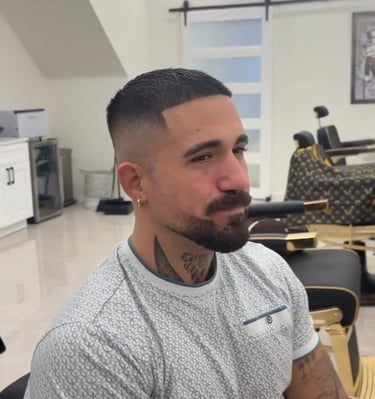 Precision zero fade and sharp beard lineup at Unlimited Barbershop in Etobicoke.