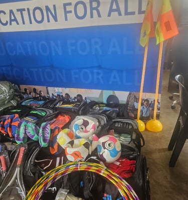 a bunch of bags with sports items and a wall banner
