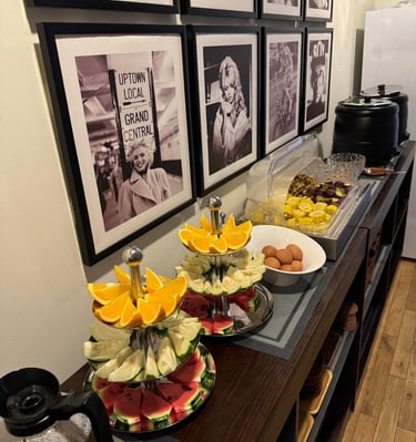 a buffet with fruit and a variety of food