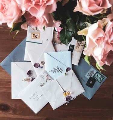 Kalligraphed handwritten love letter with quill pen on cream paper