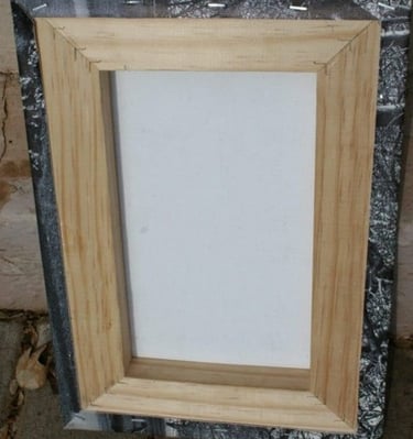 Back view of a wooden frame for a canvas print, showing the stretched canvas.