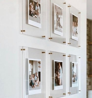 Grid of six acrylic frames displaying family photos.