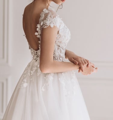 a woman in a wedding dress with a tiablet