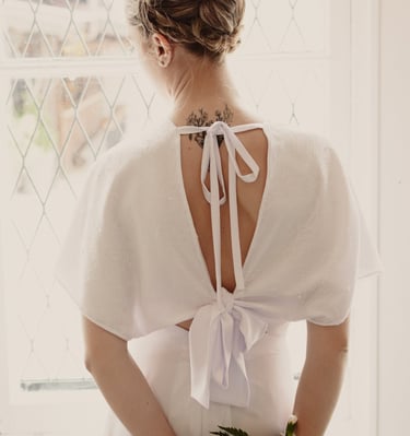 a woman in a white dress with a white dress