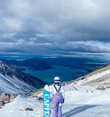 a person standing on a snowy mountain top