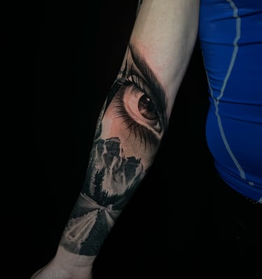 eye tattoo whit realism mauthains, one way