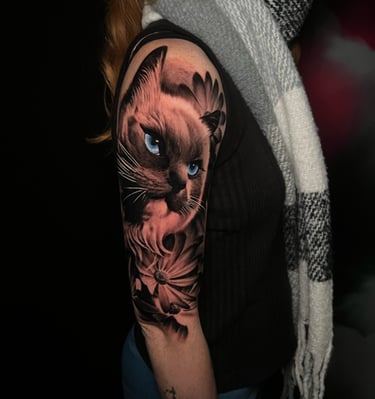 a ragdoll cat tattoo whit flowers  realism