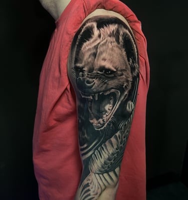 a man with a tattoo on his arm 