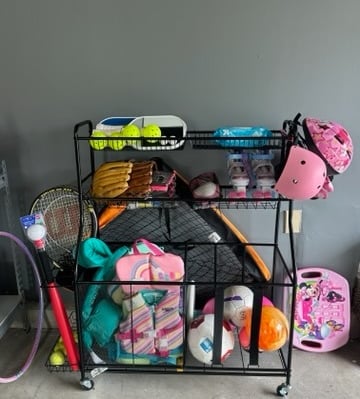 an organized sports equipment rack
