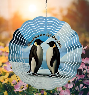 a wind spinner picturing two penguins talking about the gift of friendship.