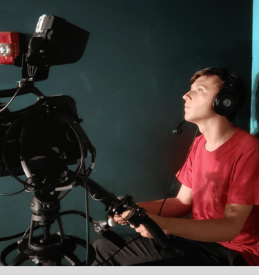 Reid Gorecki behind the camera in a tv studio