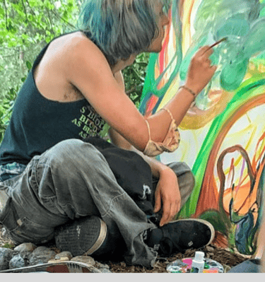 Reid Gorecki working on a painting