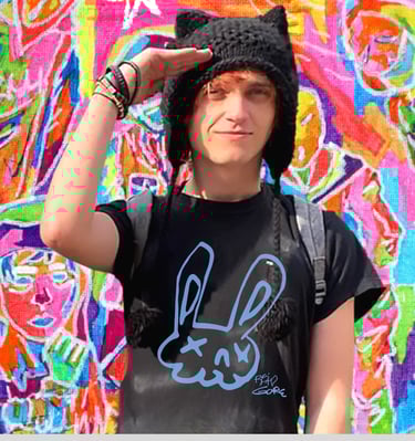 Reid Gorecki in Reid Gore tshirt saluting in a black cat hat