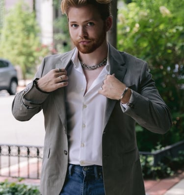 a man in a suit jacket and a white shirt