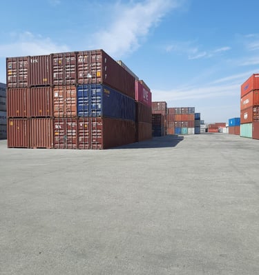 a lot of containers stacked on top of each other