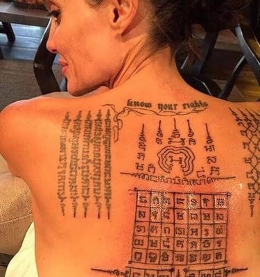 angelina jolie with thai tattoos sak yant on her back and a tattoo on her back