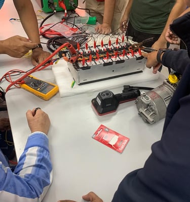 a group of people hands on electrical engineering