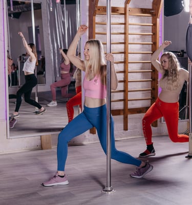 Image of women using poles for aerobic exercises