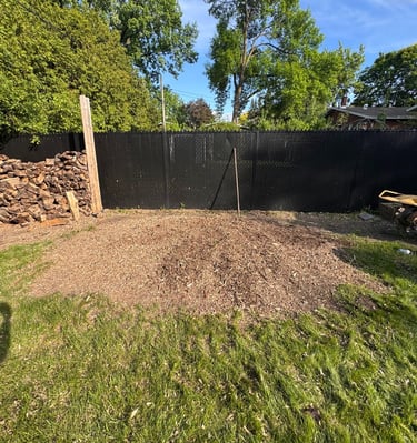 Professional stump removal using a grinder on a residential property in West Island