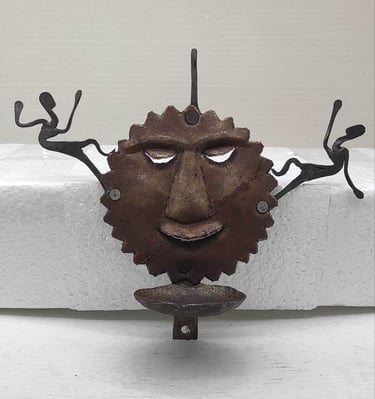 "Handcrafted iron oil lamp with sun face and two tribal figures-for export markets"