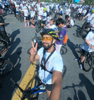 a man in a helmet and sunglasses on a bike