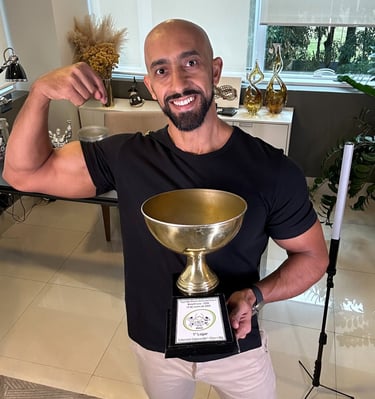 a man with a trophy in a room