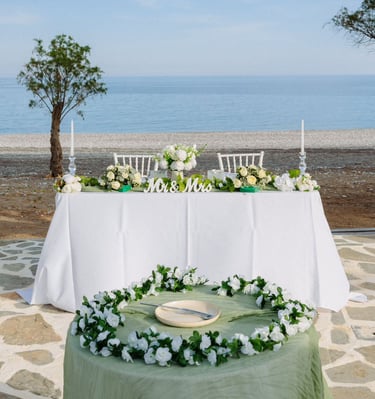 a wedding table with a wedding setting on beach