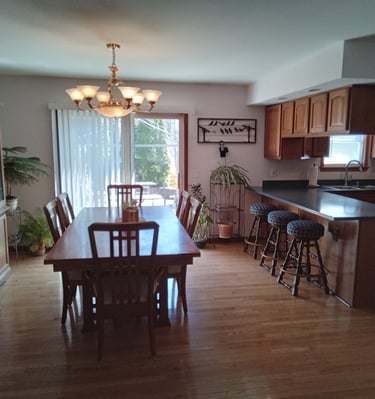 large dining area with dining room table and hutch