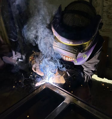 a man welding a piece of steel
