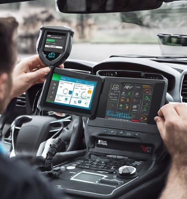 person holding black and white audio mixer