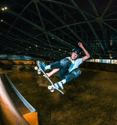 a man on a skateboard in the air pomge Marseille France skatepark