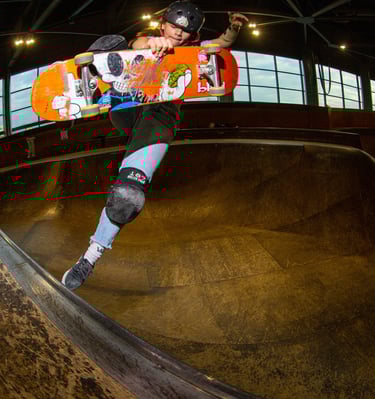 a skateboarder is doing tricks on a ramp pomge Marseille France skatepark