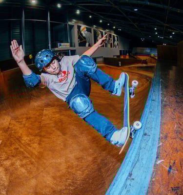 a skateboarder is doing tricks on a ramp pomge Marseille France skatepark