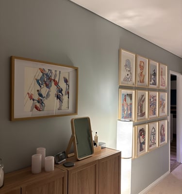 a salon hang showcasing multiple works by a single Artist
