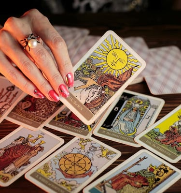 Close-up of tarot reading featuring The Sun card — guided by Amber, Queen of Wands.