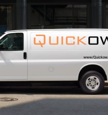 a man moving boxes into a truck