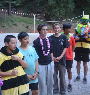 a group of campers lined up for dinner