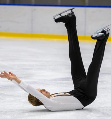 Adult figure skater performing element 6