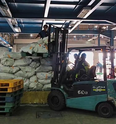 a forklift truck with a load of bags of bags of bags