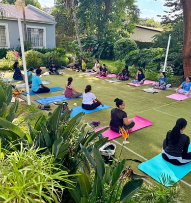 Ongoing class with Yoga participants demonstration of correct posture